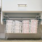 Diapers placed in pull out basket under drawer