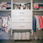 Children's clothing on racks, shelves and in drawers