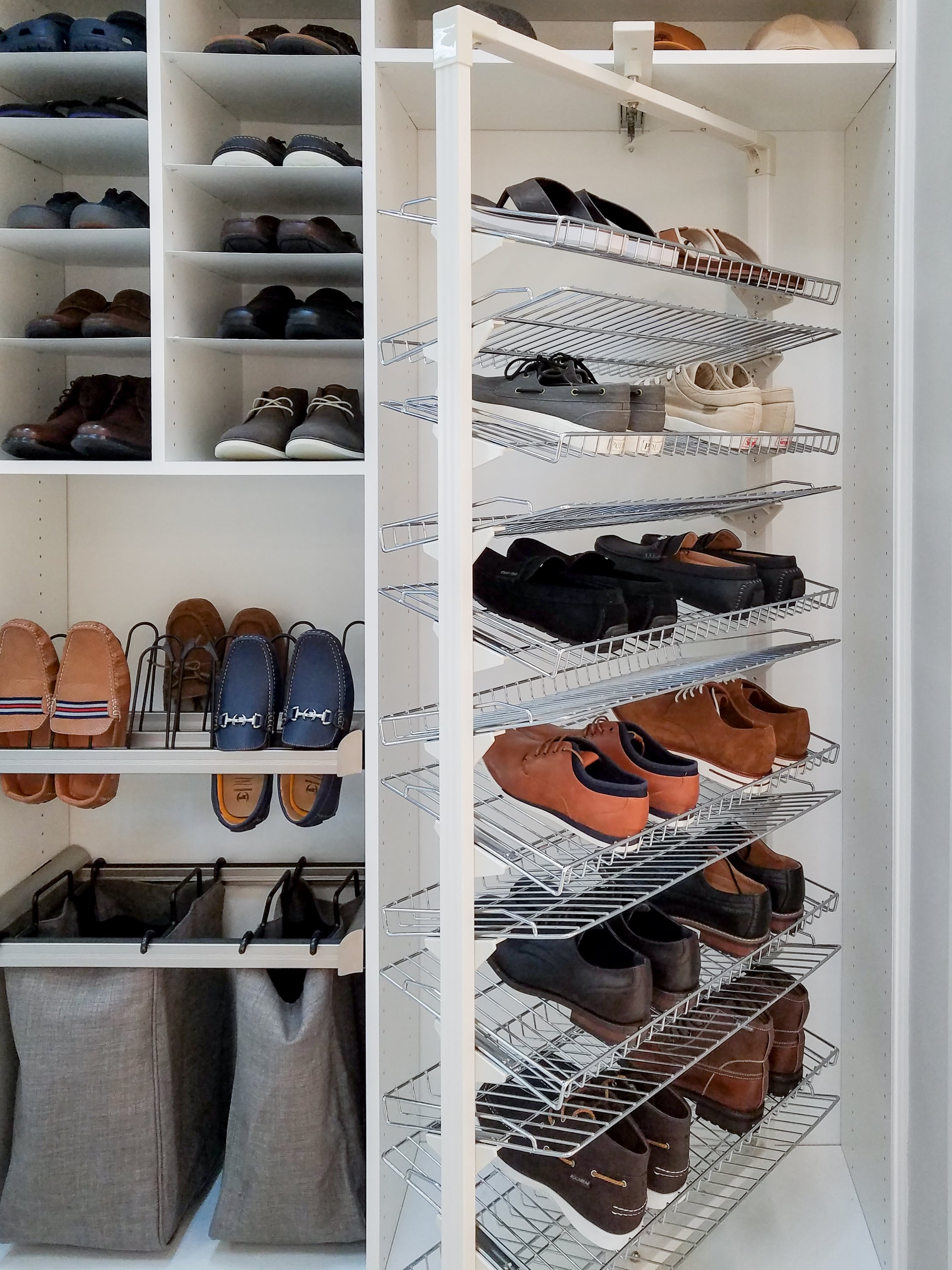 Custom shoe and hamper storage in a boutique closet in Naples, FL