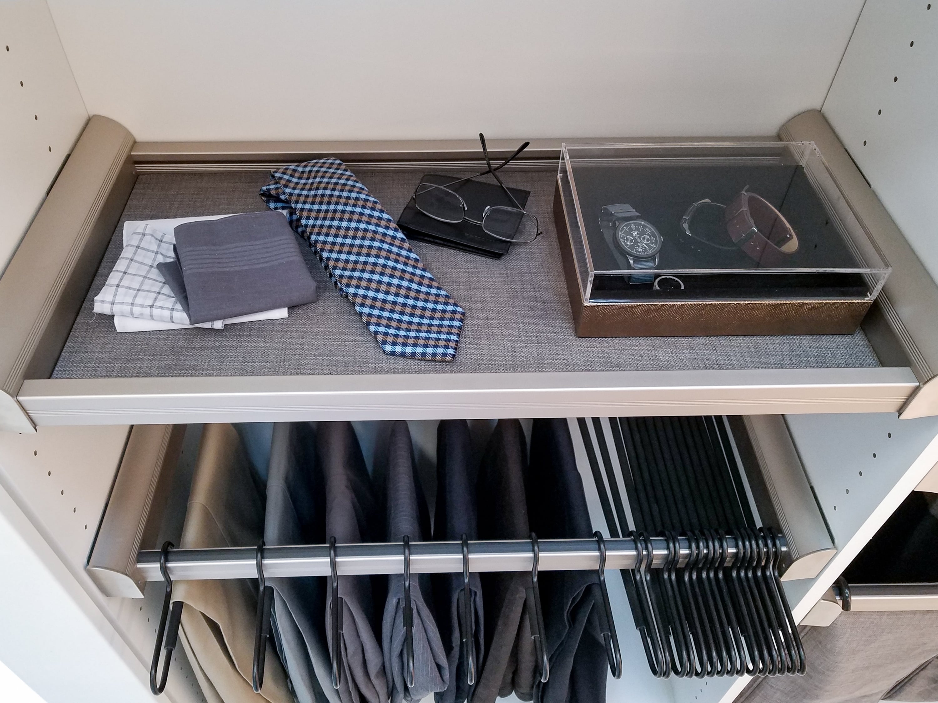 Custom pant storage in a floor mount boutique closet in Naples, FL