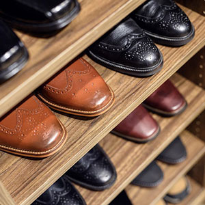 Close up of shoes on wood shelves